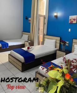 A bed or beds in a room at Hostgram Top View