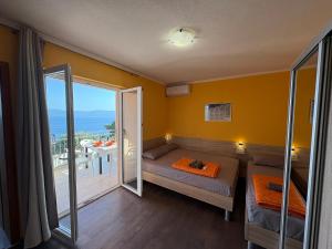 Postel nebo postele na pokoji v ubytování Apartments PEHAR
