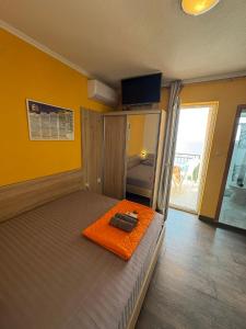 Postel nebo postele na pokoji v ubytování Apartments PEHAR
