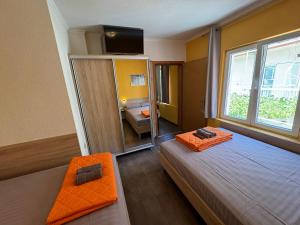 Postel nebo postele na pokoji v ubytování Apartments PEHAR