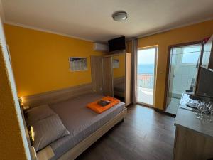 Postel nebo postele na pokoji v ubytování Apartments PEHAR