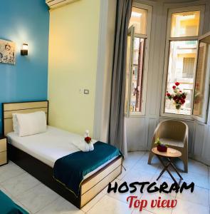 A bed or beds in a room at Hostgram Top View