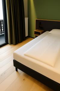 Cama ou camas em um quarto em Hotel Simader