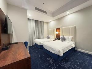 Postel nebo postele na pokoji v ubytování Hotel TELA Suite Near IGI AIrport Delhi