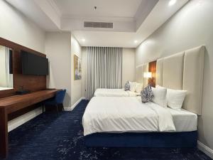 Postel nebo postele na pokoji v ubytování Hotel TELA Suite Near IGI AIrport Delhi