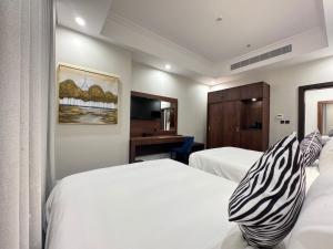 Postel nebo postele na pokoji v ubytování Hotel TELA Suite Near IGI AIrport Delhi