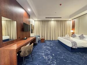 Postel nebo postele na pokoji v ubytování Hotel TELA Suite Near IGI AIrport Delhi