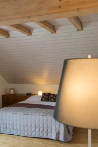 Ein Bett oder Betten in einem Zimmer der Unterkunft Auberge de la Croix Blanche