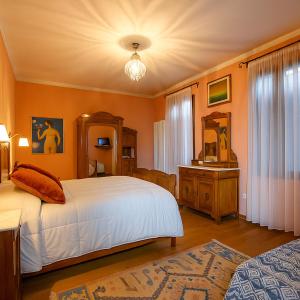 Postel nebo postele na pokoji v ubytování Agriturismo Trerè