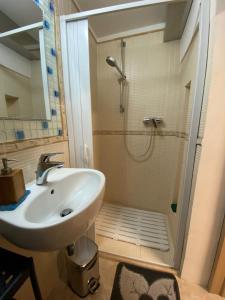 a bathroom with a sink and a shower at Casina Massari in Francavilla Fontana