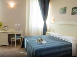 Postel nebo postele na pokoji v ubytování Hotel le Muse