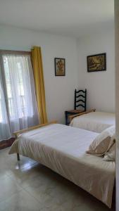 Postel nebo postele na pokoji v ubytování Casa Irama - Casa rural para grupos cerca de Aínsa - Pirineo Aragonés