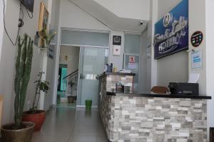a lobby of a restaurant with a cash counter at TERRA & LAKE in Puno