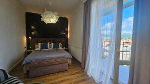 Posteľ alebo postele v izbe v ubytovaní Black Room Apartment