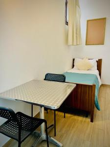a small room with a bed and a table at CASA BANON in Venice +39 photos