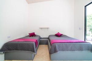 Postel nebo postele na pokoji v ubytování Casa las palmas