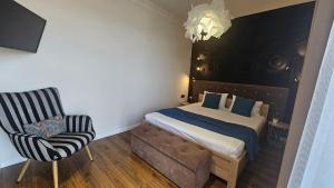Posteľ alebo postele v izbe v ubytovaní Black Room Apartment