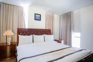 Giường trong phòng chung tại Nhat Linh Hotel & Suites Da Nang