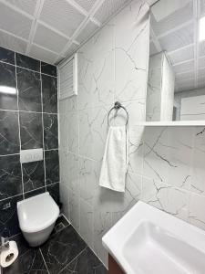 Koupelna v ubytování Renaissance Apart Hotel