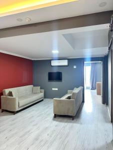 TV a/nebo společenská místnost v ubytování Renaissance Apart Hotel