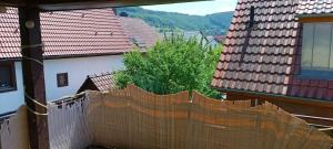 a fence in the middle of a city with buildings at Cosy Apartment Geislingen in Geislingen an der Steige
