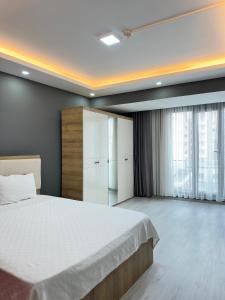 Postel nebo postele na pokoji v ubytování Renaissance Apart Hotel + 37 fotografií