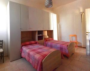 A bed or beds in a room at Casa Polinisso