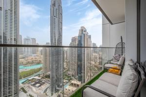 a balcony with a view of a city at Stylish 2BR with Boulevard View & 5 min from Dubai Mall in Dubai