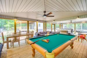 a pool table in a living room with a ceiling at 13 Mi to Guntersville Lake Henagar Gem with Hot Tub in Pisgah