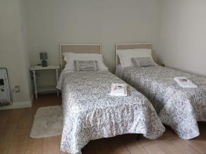 two beds sitting next to each other in a room at B&B Federico in San Demetrio Corone