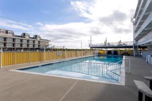 a swimming pool on the side of a building at 6201 Ocean Ave, Unit 505 - The Nassau Inn in Wildwood +16 photos