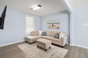 a living room with a couch and a table at 110 E 24Th Ave, Unit A in Wildwood
