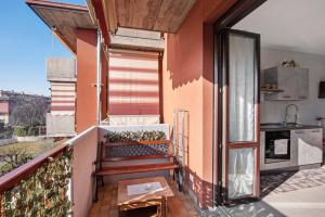 a balcony with a door open to a kitchen at Grazioso Bilocale vicino Bergamo in Seriate