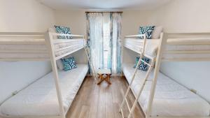 Ένα ή περισσότερα κρεβάτια σε δωμάτιο στο Sandpiper Cove 0022 +83 φωτογραφίες