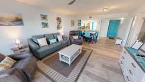 a living room with a couch and a table at SeaCrest 306 in Fort Walton Beach