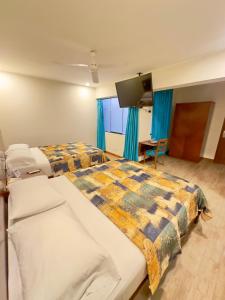 Postel nebo postele na pokoji v ubytování Hotel Esencia Suites