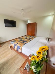 Postel nebo postele na pokoji v ubytování Hotel Esencia Suites