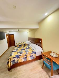 Postel nebo postele na pokoji v ubytování Hotel Esencia Suites