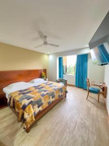 Postel nebo postele na pokoji v ubytování Hotel Esencia Suites