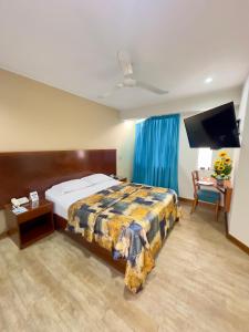 Postel nebo postele na pokoji v ubytování Hotel Esencia Suites