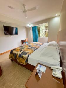 TV a/nebo společenská místnost v ubytování Hotel Esencia Suites