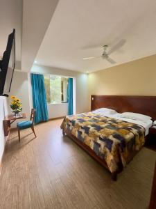 Postel nebo postele na pokoji v ubytování Hotel Esencia Suites
