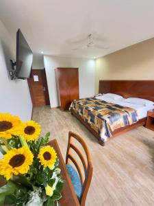Postel nebo postele na pokoji v ubytování Hotel Esencia Suites