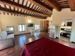 a living room with a couch and a table at Casale San Francesco d'Assisi in Assisi +34 photos