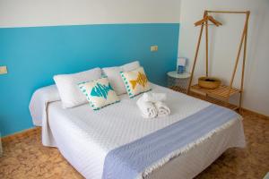 Postel nebo postele na pokoji v ubytování H El Palmeral Playa