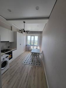 Kuchyň nebo kuchyňský kout v ubytování cosy apartment + 3 fotografie