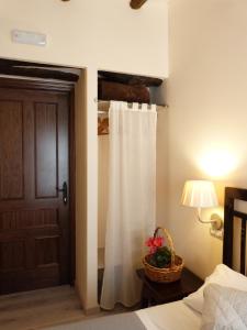 A bed or beds in a room at Cal Vibo