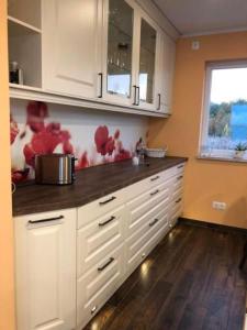 Kuchyň nebo kuchyňský kout v ubytování Schwimmendes Haus Elandi + 32 fotografií