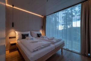 Posteľ alebo postele v izbe v ubytovaní Hotel Björnson & Björnson TREE HOUSES Jasná