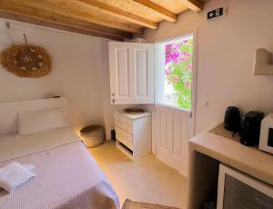Ένα ή περισσότερα κρεβάτια σε δωμάτιο στο Kamara Residence & Suites